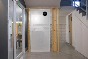 a bathroom with a shower with a glass door at Siam Mansion - SHA in Hat Yai +94 photos
