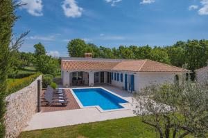 a villa with a swimming pool in a yard at Villa Sever in Labin