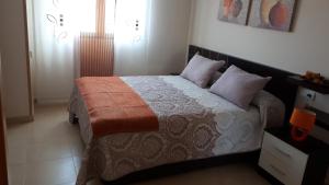 Rúm í herbergi á Piso C Arévalo