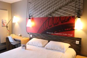 Letto o letti in una camera di ibis Montargis