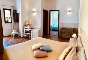 Rúm í herbergi á Boutique Hotel Sant'Andrea & Relais