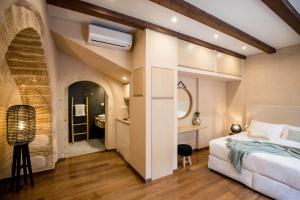 מיטה או מיטות בחדר ב-J&G Suites