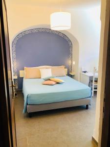 Rúm í herbergi á Boutique Hotel Sant'Andrea & Relais