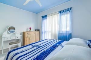 Кровать или кровати в номере House Riva