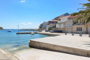 a view of a body of water with buildings at House Riva in Zavalatica