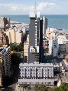 an aerial view of a city with a tall building at Hotel 13 de Julio in Mar del Plata