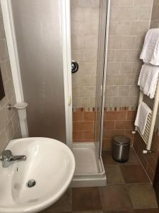 a bathroom with a shower and a white sink at Il Podere del Carlone in Vasto +16 photos
