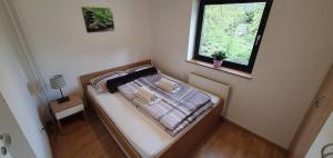 Postel nebo postele na pokoji v ubytování Apartment Alpska Astra + 22 fotografií