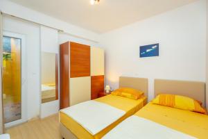 Postel nebo postele na pokoji v ubytování Apartments Vesna