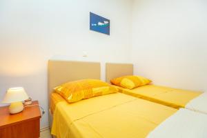 Postel nebo postele na pokoji v ubytování Apartments Vesna