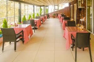 a restaurant with red and white tables and chairs at Venue Hotel Istanbul Old City in Istanbul