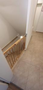 an empty room with a staircase and a tile floor at Apartment Alpska Astra in Kranjska Gora