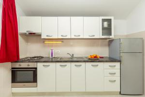 Kuchyň nebo kuchyňský kout v ubytování Apartments Vesna