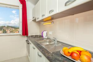 Kuchyň nebo kuchyňský kout v ubytování Apartments Vesna