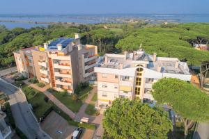an overhead view of a building with trees and water at Al Parco in Rosolina Mare