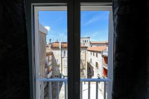 an open window with a view of a city at Aldo Apartments Center in Zadar