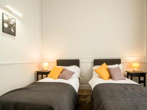 A bed or beds in a room at Holidays Suites Navona