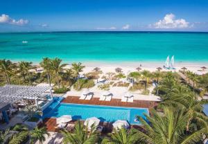 an aerial view of a resort with a pool and the beach at Beaches Turks and Caicos Resort Villages and Spa All Inclusive in Providenciales