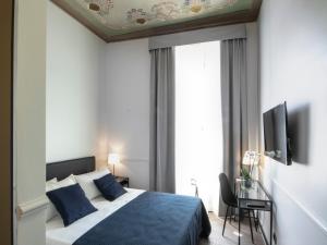 Voodi või voodid majutusasutuse Gemini Suites Navona toas