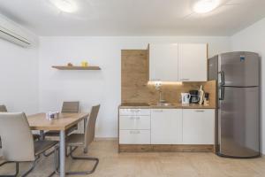 Kuchyň nebo kuchyňský kout v ubytování Holiday Home Jakob