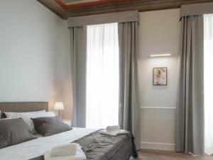Voodi või voodid majutusasutuse Gemini Suites Navona toas