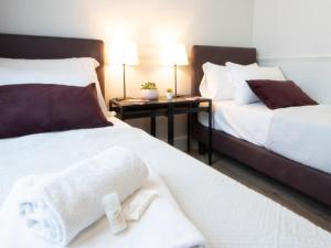 Voodi või voodid majutusasutuse Gemini Suites Navona toas