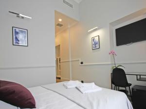 Voodi või voodid majutusasutuse Gemini Suites Navona toas
