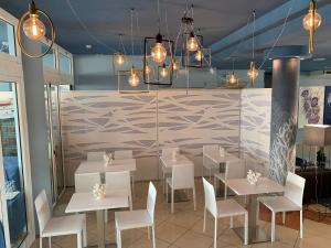 Reštaurácia alebo iné gastronomické zariadenie v ubytovaní Villaggio Hemingway - Family Aparthotel