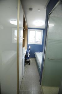 a room with a bed and a desk and a chair at The Core Albergue in Seoul +78 photos