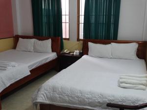 Postel nebo postele na pokoji v ubytování Thuong Hai Hotel