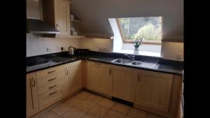 an empty kitchen with a sink and a window at Luxury 2Bedroom Lodge in Auchterarder