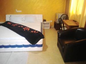 Postel nebo postele na pokoji v ubytování Meka Hotel