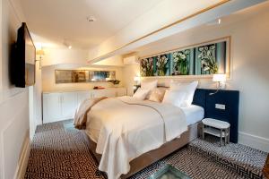 Tempat tidur dalam kamar di Amber Design Residence