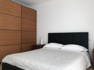 A bed or beds in a room at Appartamenti Stella Del Mare