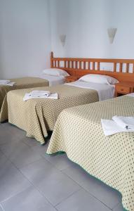 Postel nebo postele na pokoji v ubytování Hostal Isabel