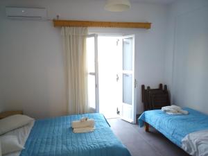 Letto o letti in una camera di Hotel Perissa