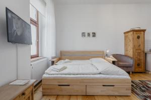 Postel nebo postele na pokoji v ubytování Apartmán 3, Suvorovova 158