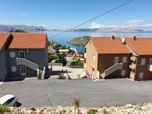 a group of houses with a view of the water at Slavica apartments 2 in Sveti Juraj