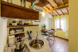 a kitchen with a sink and a counter top at La Rocca Romantica in San Gimignano