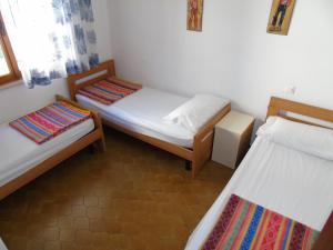 Postel nebo postele na pokoji v ubytování Villa Fidia
