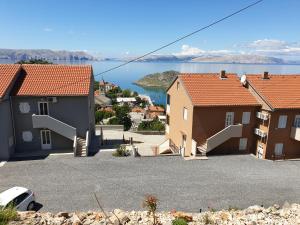 a group of houses with a view of the water at Slavica apartments 3 in Sveti Juraj