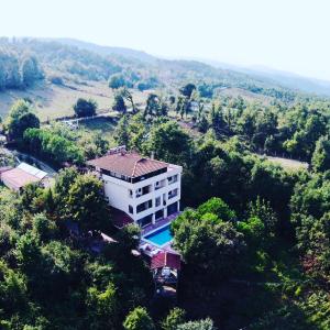 an aerial view of a building with a swimming pool at Kaltur Boutique Hotel in Yalova