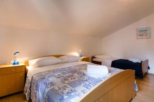 Posteľ alebo postele v izbe v ubytovaní Apartman Sintić