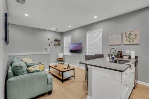 a kitchen and living room with a couch and a sink at New 1/1 :Loft Minutes From Heart of Tampa -Unit C in Tampa +9 photos