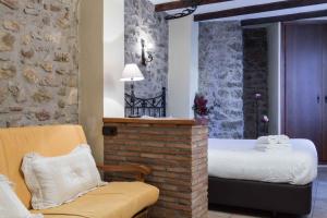 A bed or beds in a room at Complejo Rural Turimaestrat