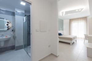 Koupelna v ubytování Alfema Rooms + 37 fotografií