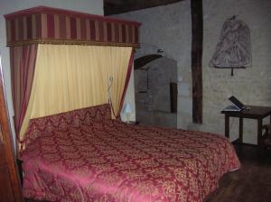 Postel nebo postele na pokoji v ubytování Auberge de l'Abbatiale