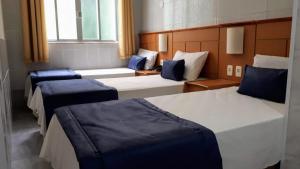 Tempat tidur dalam kamar di Hotel Único