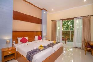 Postel nebo postele na pokoji v ubytování Adi Jaya Cottages Ubud Suites by EPS - CHSE Certified + 37 fotografií