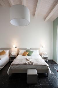 A bed or beds in a room at Casamata